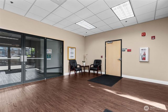a view of a livingroom with furniture nad wooden floor