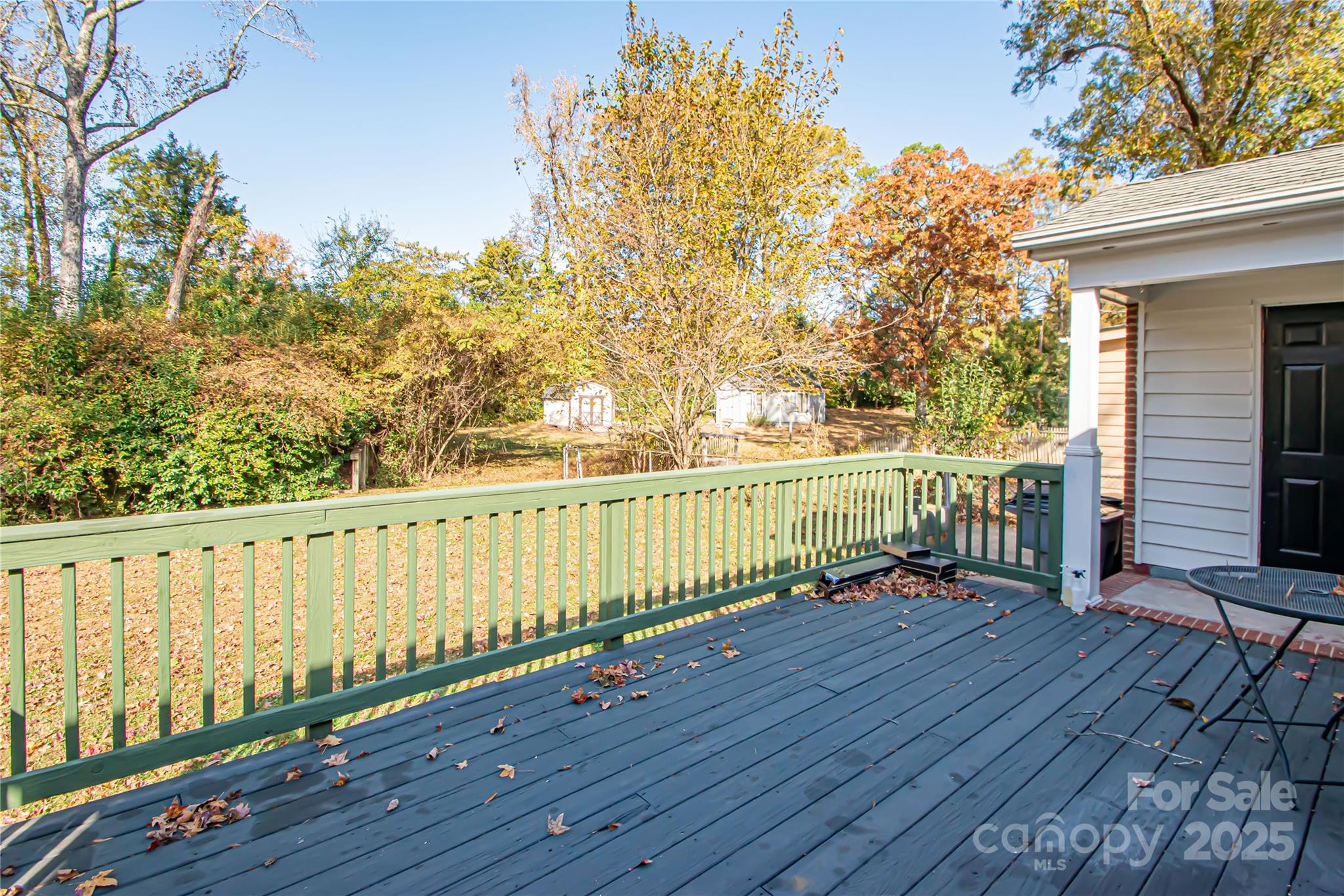 1741 Dallas Avenue Charlotte, NC 28205 - Photo 11 of 40 a view of a balcony with wooden floor and fence