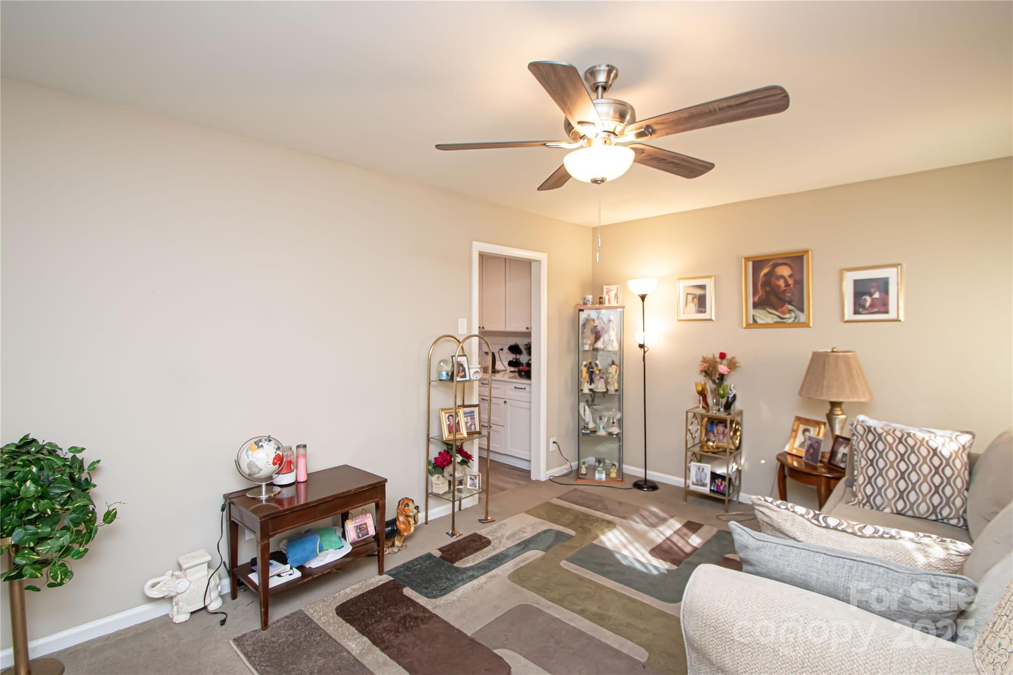 1741 Dallas Avenue Charlotte, NC 28205 - Photo 16 of 40 a living room with furniture and a chandelier