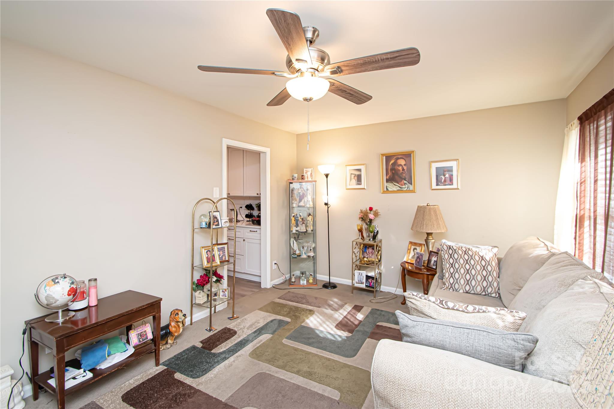1741 Dallas Avenue Charlotte, NC 28205 - Photo 17 of 40 a living room with furniture and a chandelier