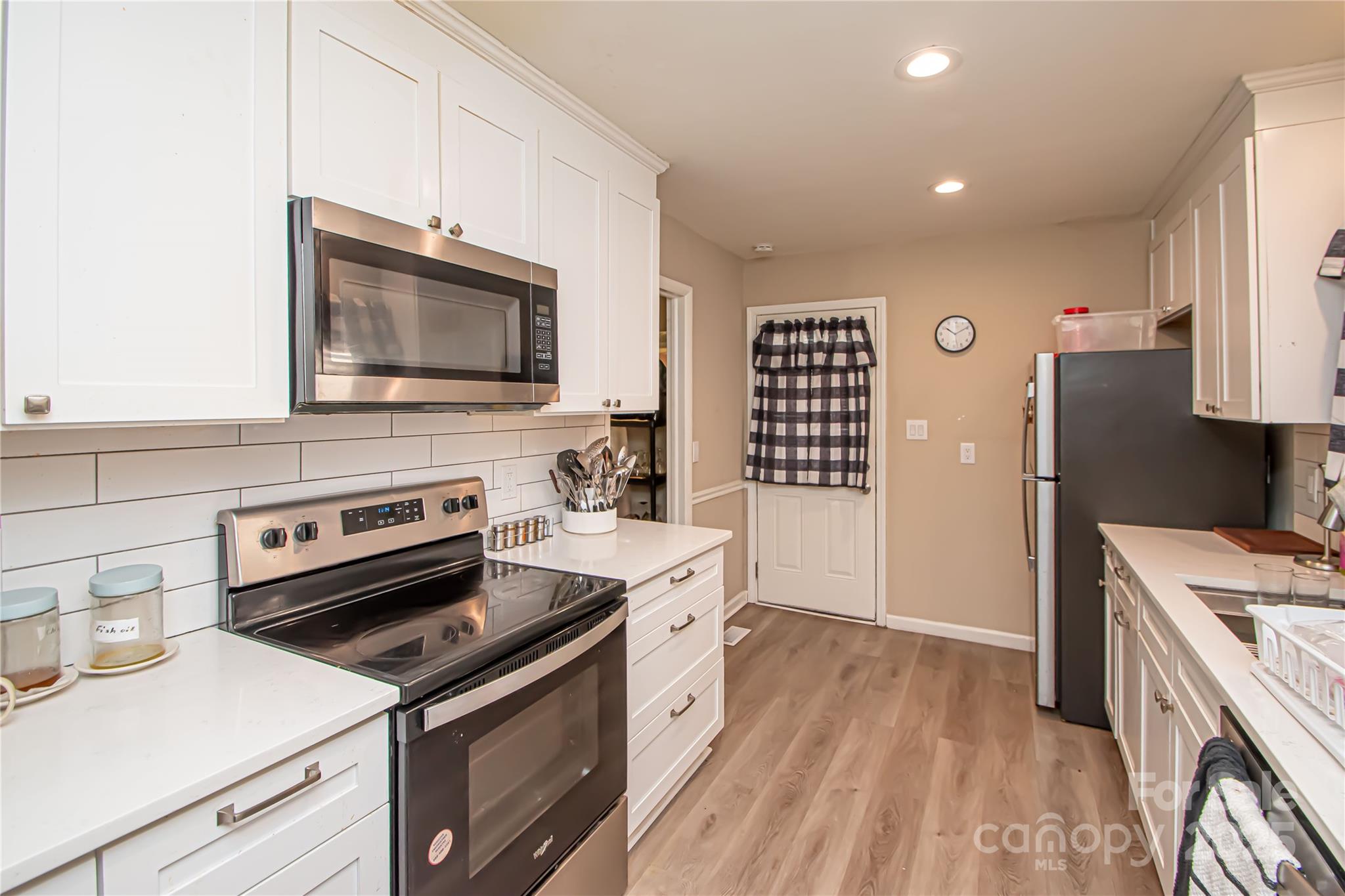 1741 Dallas Avenue Charlotte, NC 28205 - Photo 20 of 40 a kitchen with a stove microwave and sink