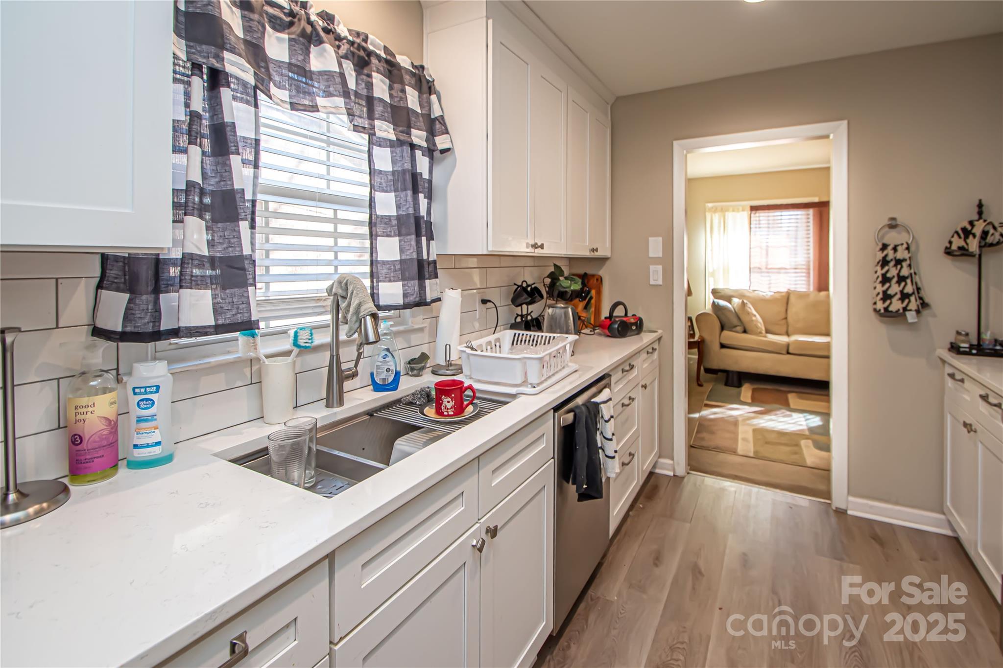 1741 Dallas Avenue Charlotte, NC 28205 - Photo 23 of 40 a kitchen with stainless steel appliances a sink stove and cabinets