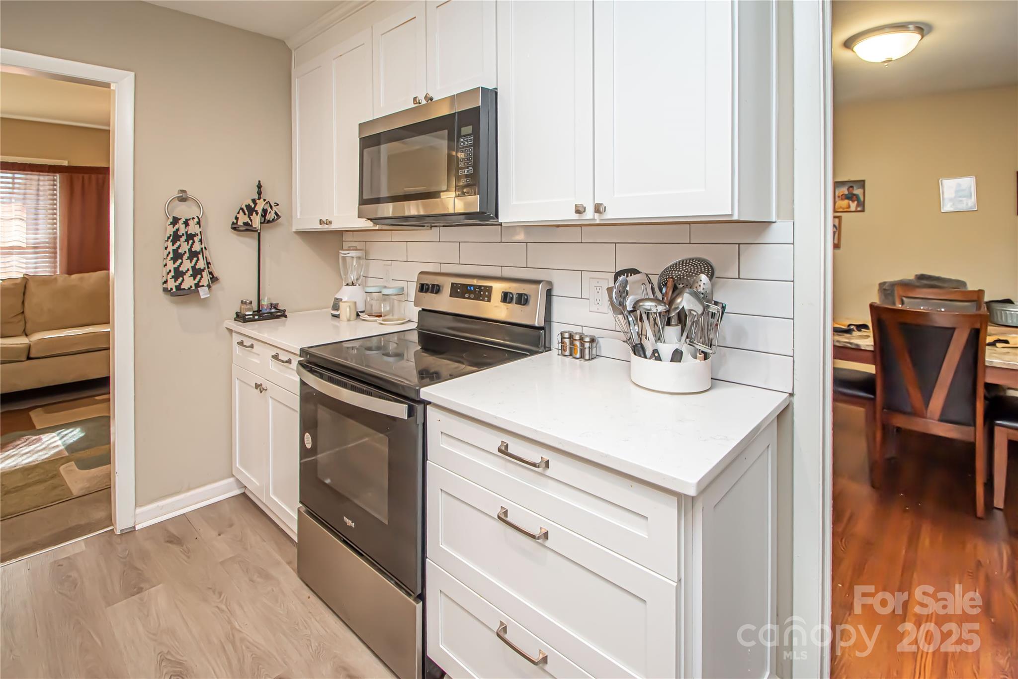 1741 Dallas Avenue Charlotte, NC 28205 - Photo 24 of 40 a kitchen with a stove and a microwave