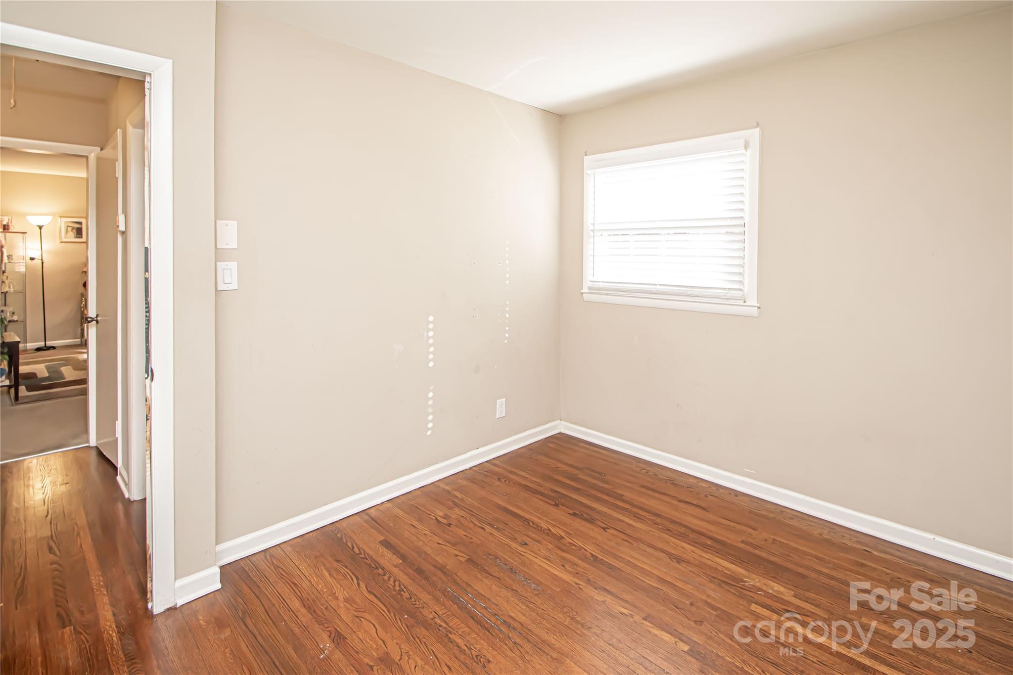 1741 Dallas Avenue Charlotte, NC 28205 - Photo 31 of 40 a view of an empty room with wooden floor