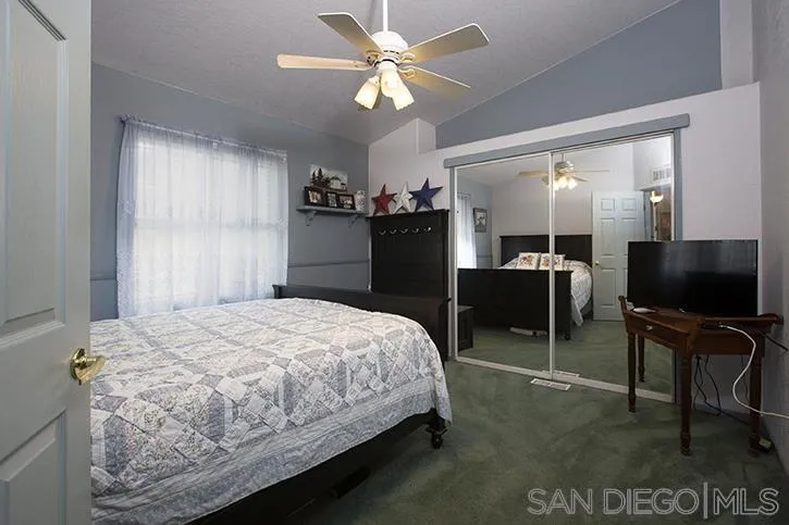 854 South Grade Road Alpine, CA 91901 - Photo 12 of 15 a bedroom with a bed and a flat screen tv