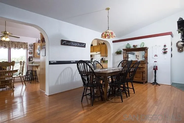 854 South Grade Road Alpine, CA 91901 - Photo 5 of 15 a view of a dining room with furniture and wooden floor