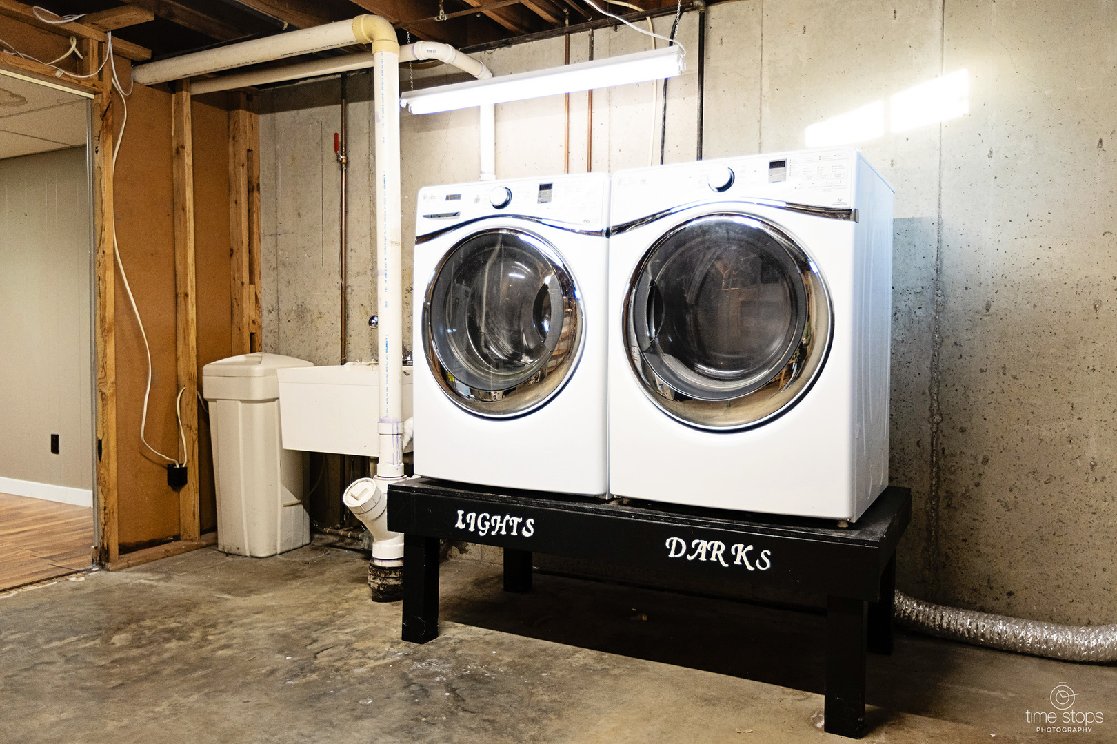 767 Adams Street Ottawa, IL 61350 - Photo 24 of 28 a view of washer and dryer with kitchen in the background
