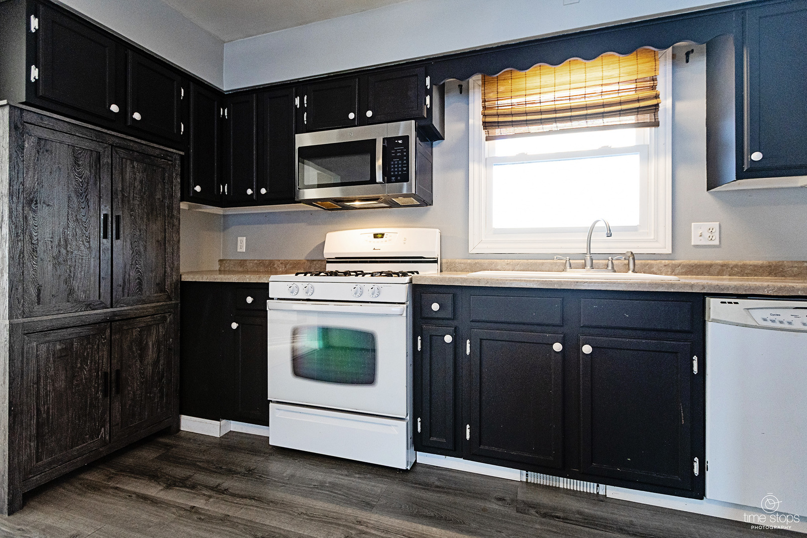 767 Adams Street Ottawa, IL 61350 - Photo 4 of 28 a kitchen with a sink stove and microwave