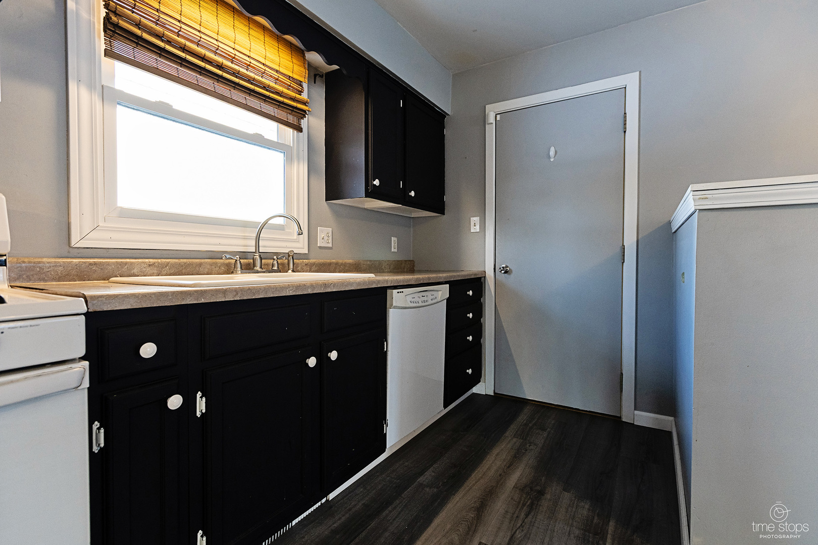767 Adams Street Ottawa, IL 61350 - Photo 6 of 28 a kitchen with a sink and a mirror