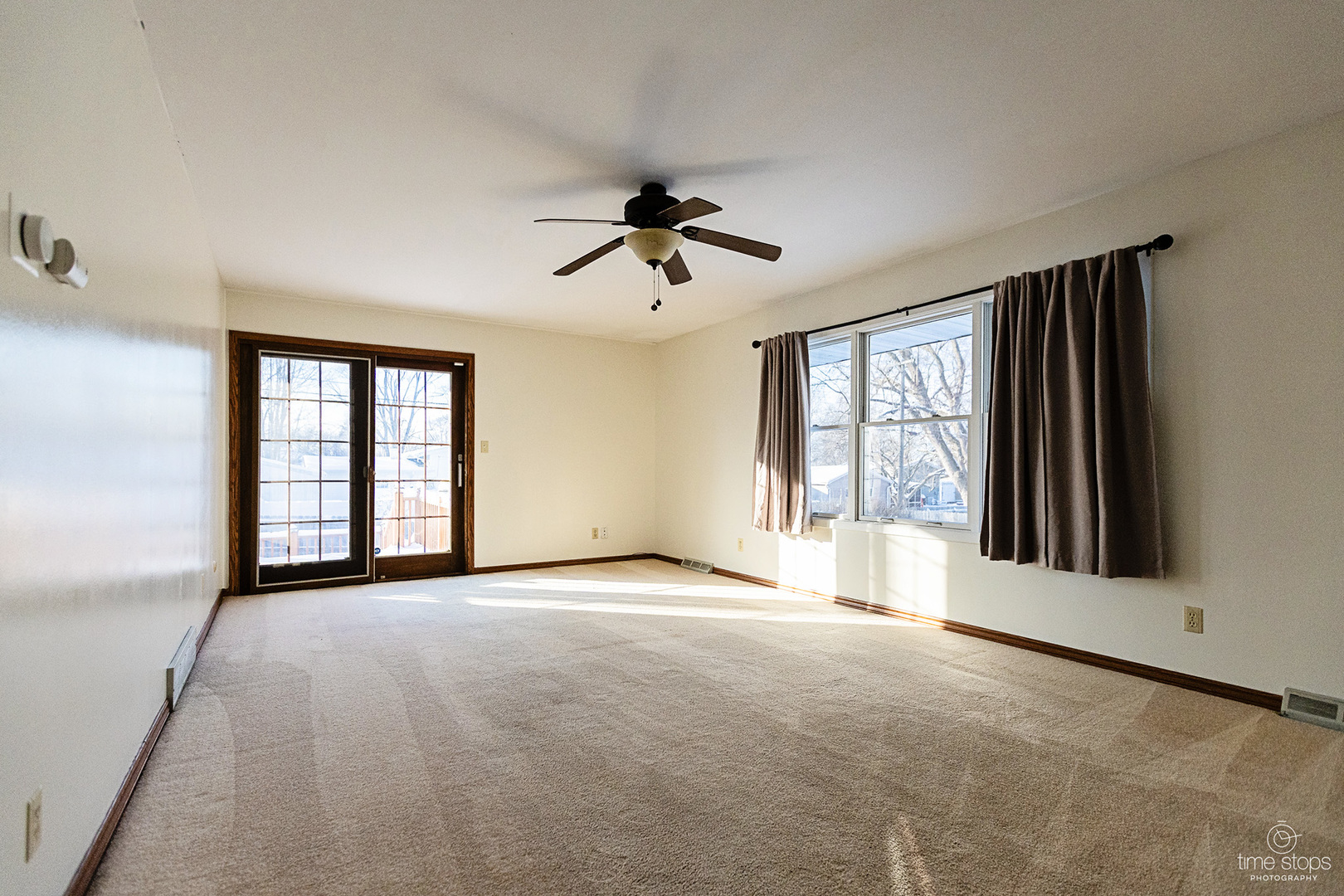 767 Adams Street Ottawa, IL 61350 - Photo 7 of 28 a view of a big room with windows and chandelier fan