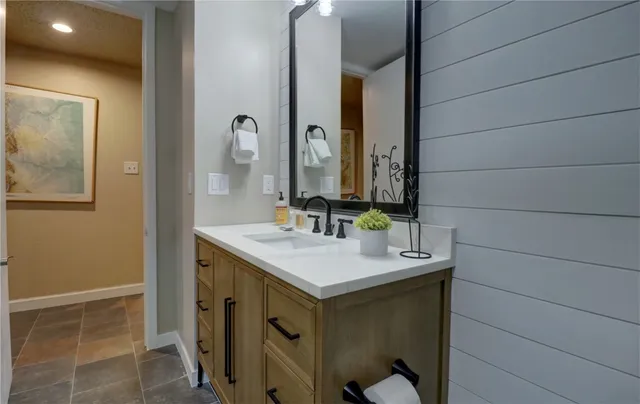 a bathroom with a sink and a mirror