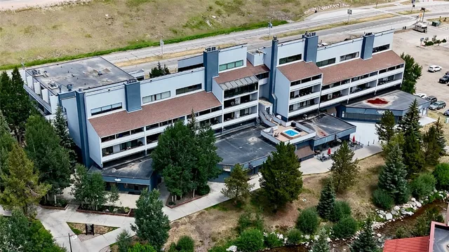an aerial view of a house with a garden