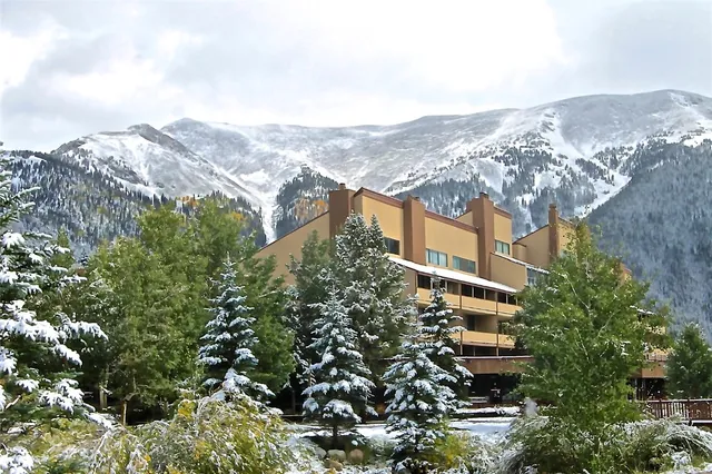 an aerial view of houses with a street