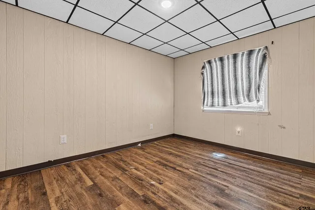 a view of a room with wooden walls
