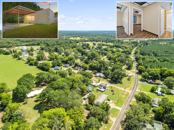 a view of backyard of house with green space