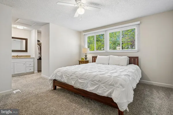 a bedroom with a bed and a table