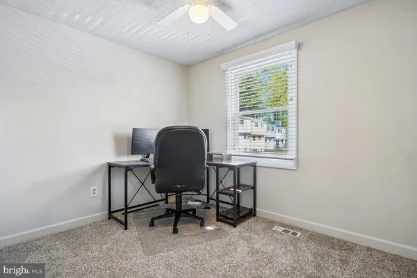 a workspace with furniture and a window