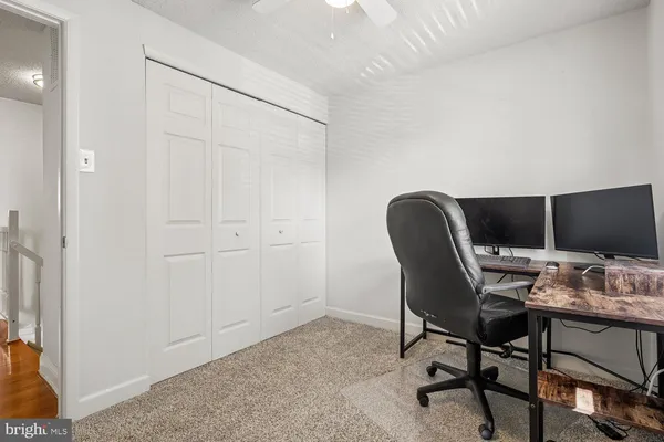 a workspace with furniture and a window
