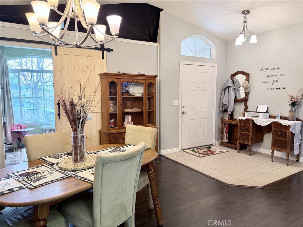 7915 Outpost Road Oak Hills, CA 92344 - Photo 11 of 54 a living room with dining table