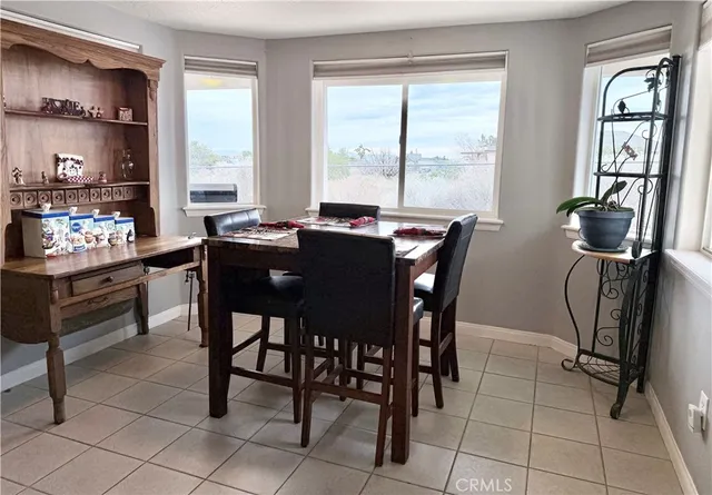 a kitchen with a refrigerator and a stove
