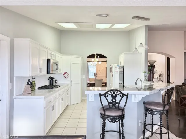 a kitchen with a sink cabinets and window