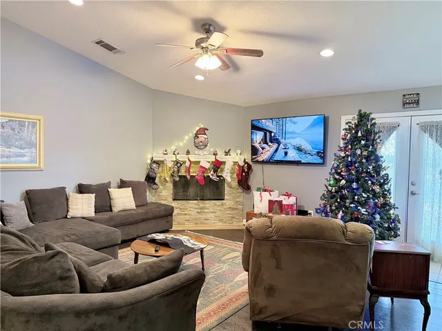 a living room with furniture and flowers