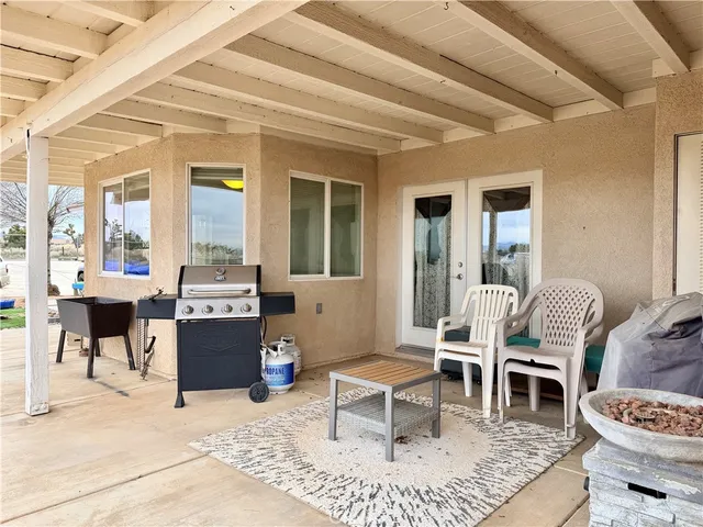 a view of a backyard of the house