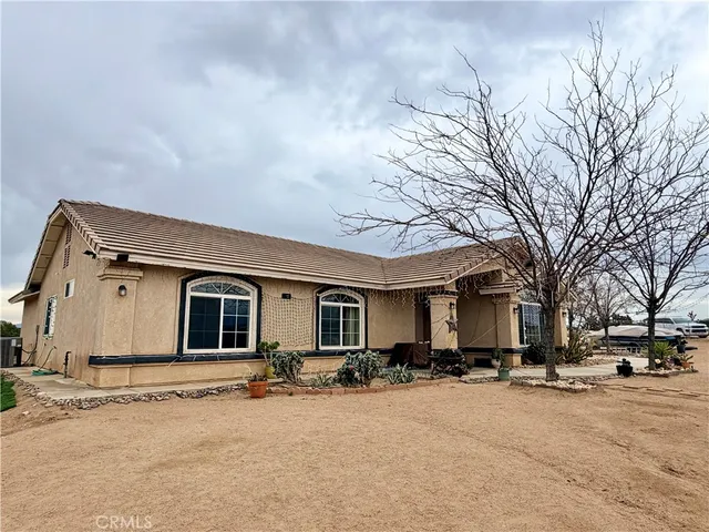 a bathroom with a sink a toilet and shower curtain