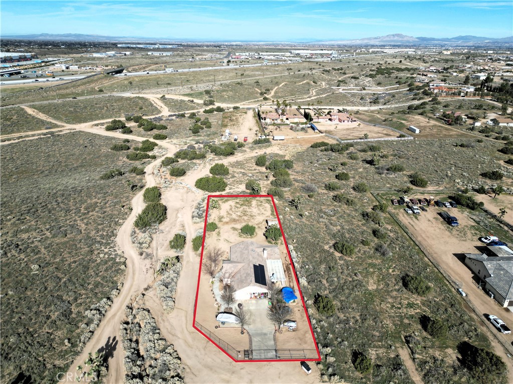 7915 Outpost Road Oak Hills, CA 92344 - Photo 46 of 54 an aerial view of residential houses with outdoor space