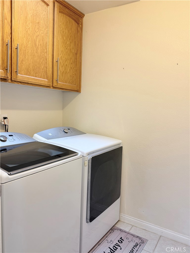 7915 Outpost Road Oak Hills, CA 92344 - Photo 54 of 54 a utility room with dryer and washer