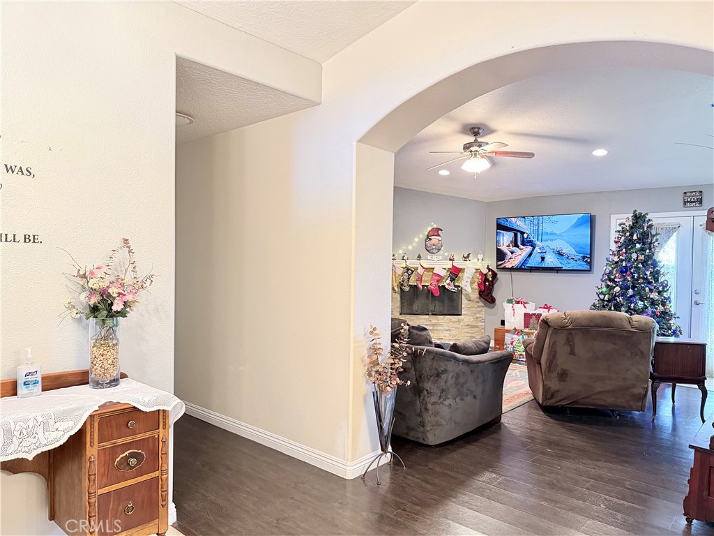 7915 Outpost Road Oak Hills, CA 92344 - Photo 9 of 54 a living room with furniture and a flat screen tv