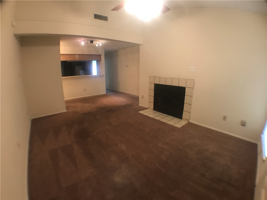 806 West 24th Street, Unit 304 Austin, TX 78705 - Photo 4 of 17 a view of empty room with a fireplace