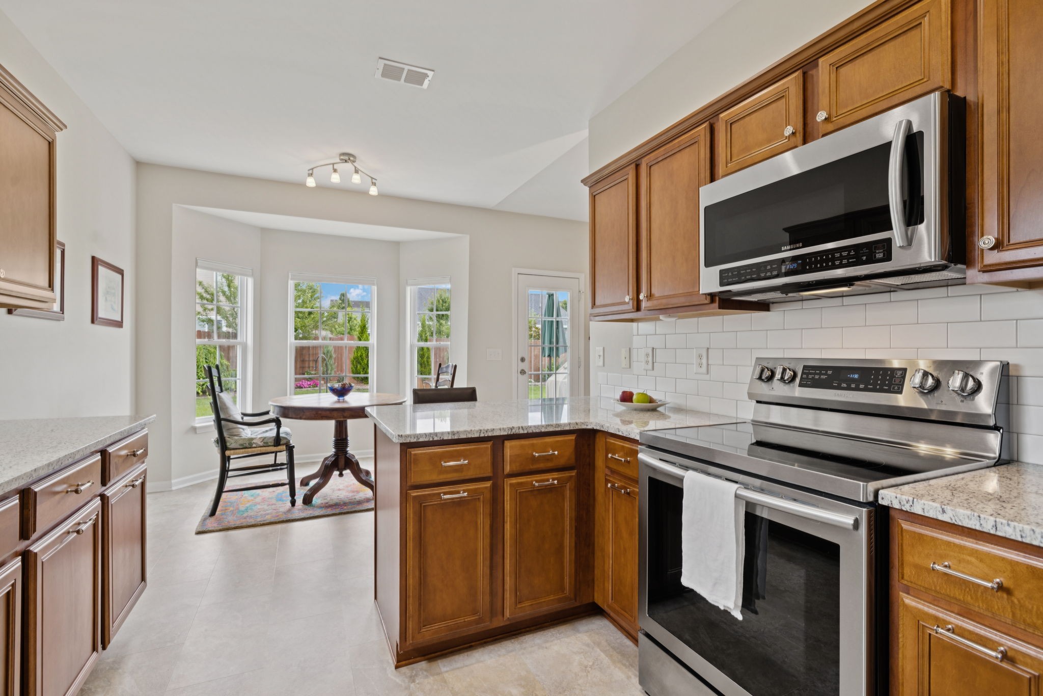 4060 Sequoia Trail Spring Hill, TN 37174 - Photo 14 of 41 a kitchen with stainless steel appliances a stove microwave and sink