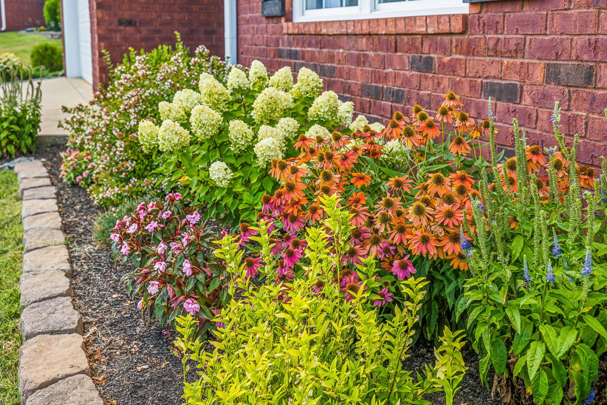 4060 Sequoia Trail Spring Hill, TN 37174 - Photo 39 of 41 a bunch of flowers in front of a building