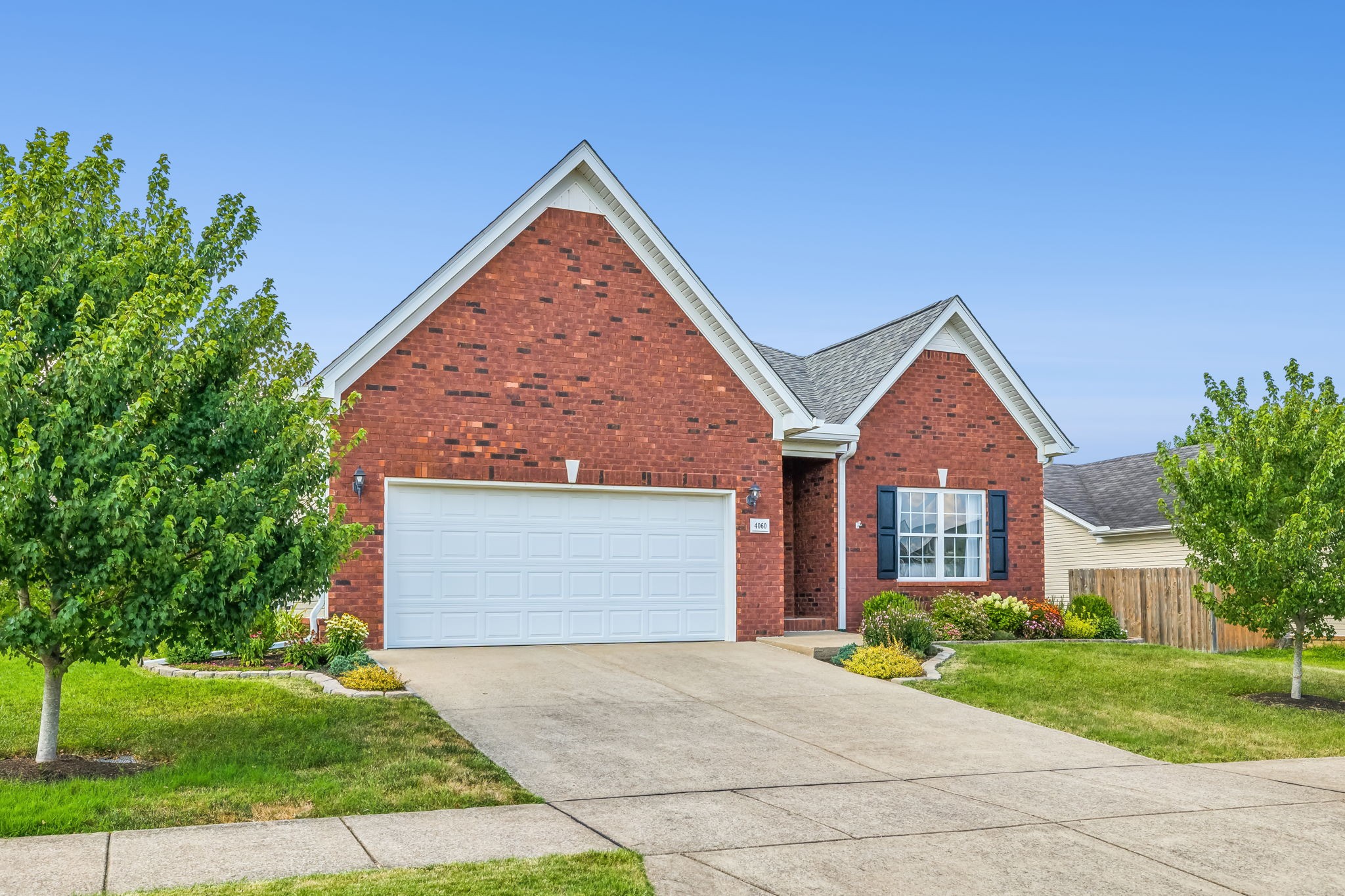 4060 Sequoia Trail Spring Hill, TN 37174 - Photo 40 of 41 a front view of a house with a yard and garage