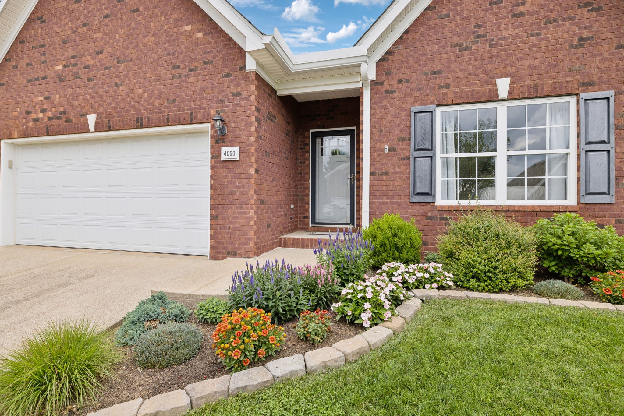 4060 Sequoia Trail Spring Hill, TN 37174 - Photo 4 of 41 front view of a brick house with a yard