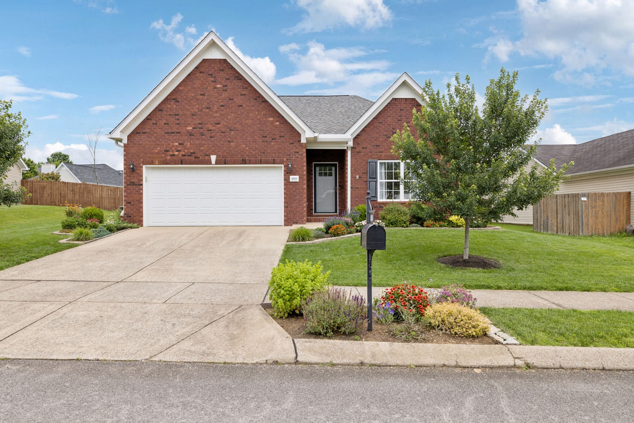 4060 Sequoia Trail Spring Hill, TN 37174 - Photo 41 of 41 a front view of a house with a yard and garage