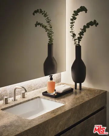 a vase of flowers sitting on a table