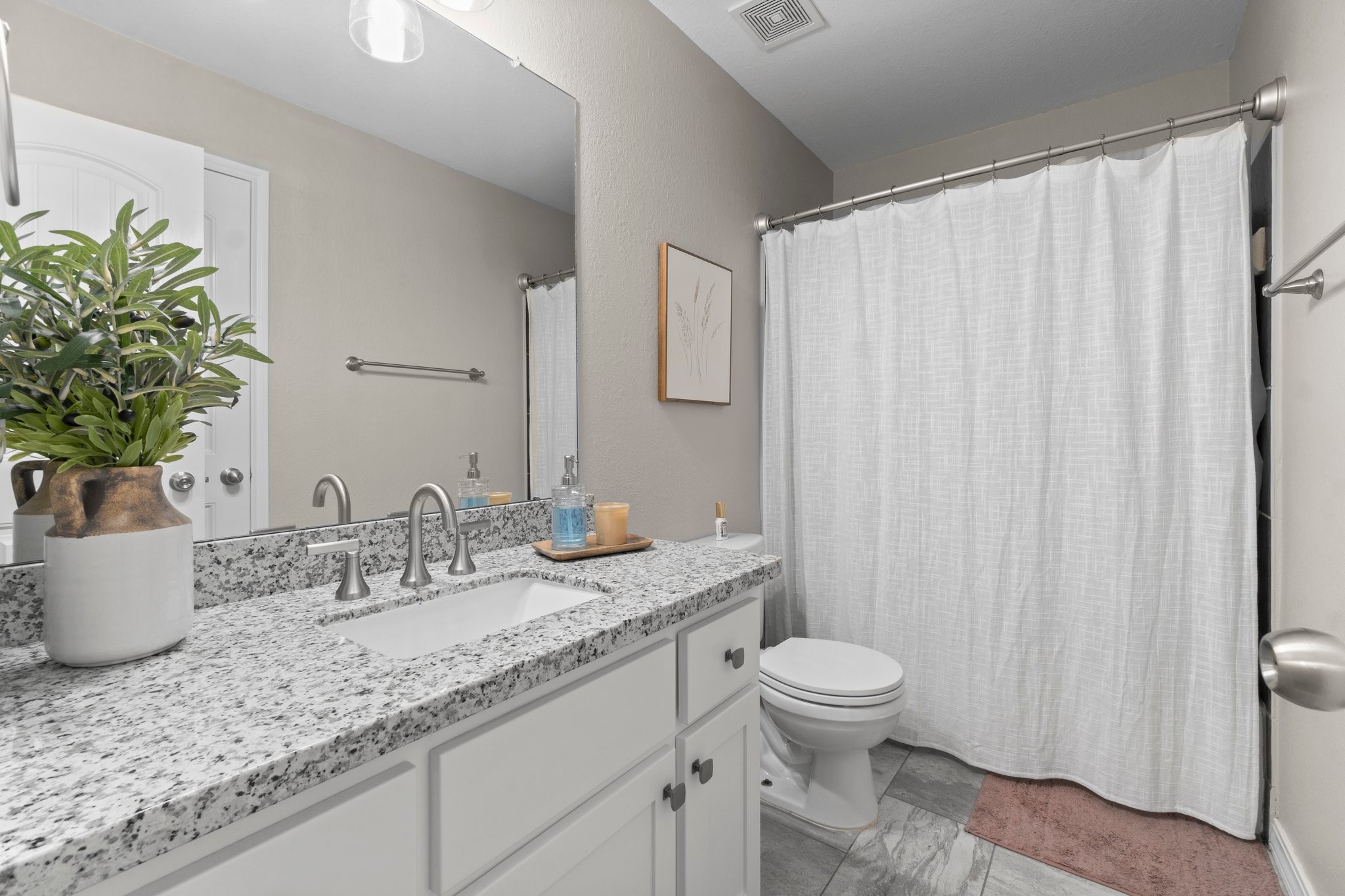 28987 Birch Green Way Spring, TX 77386 - Photo 25 of 32 a bathroom with a granite countertop sink and a mirror