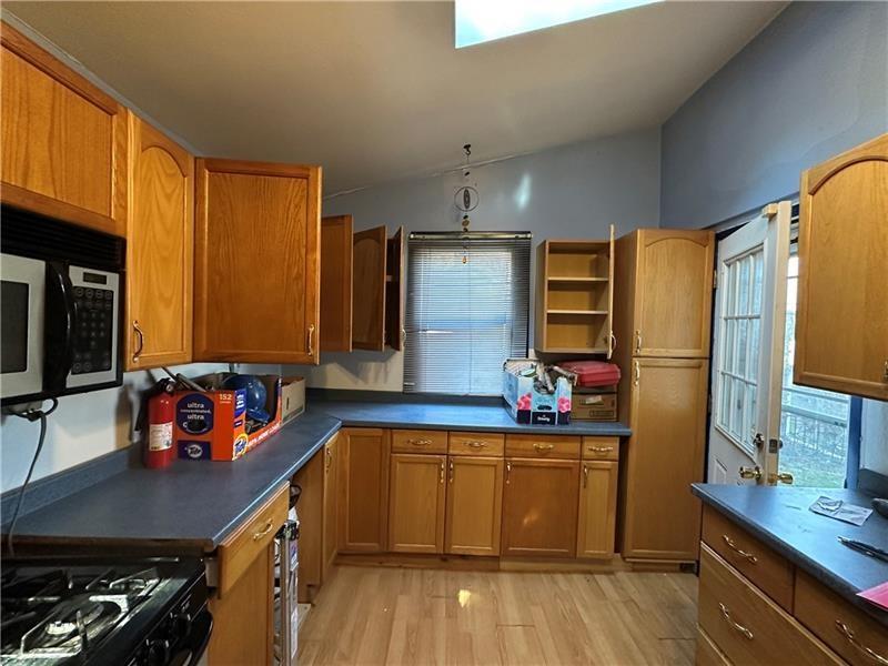 1447 Fleming Avenue McKees Rocks, PA 15136 - Photo 16 of 37 a kitchen with stainless steel appliances a refrigerator and a stove