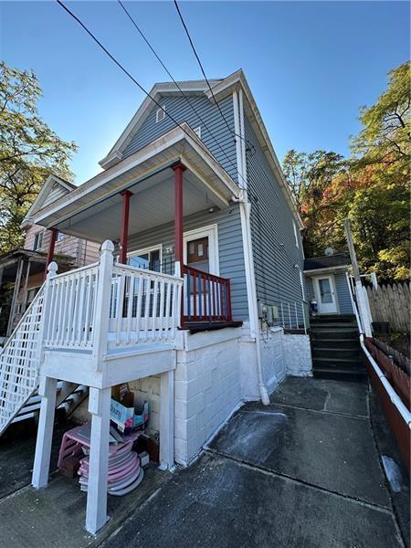 1447 Fleming Avenue McKees Rocks, PA 15136 - Photo 2 of 37 a view of a house with wooden deck front of house