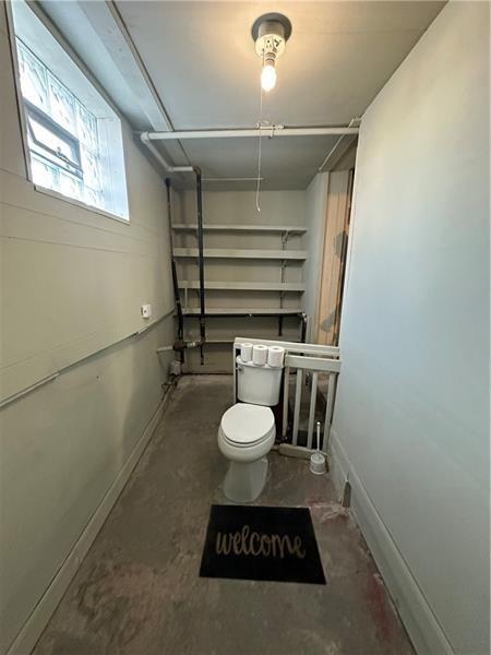1447 Fleming Avenue McKees Rocks, PA 15136 - Photo 32 of 37 a bathroom with a toilet a sink and a window