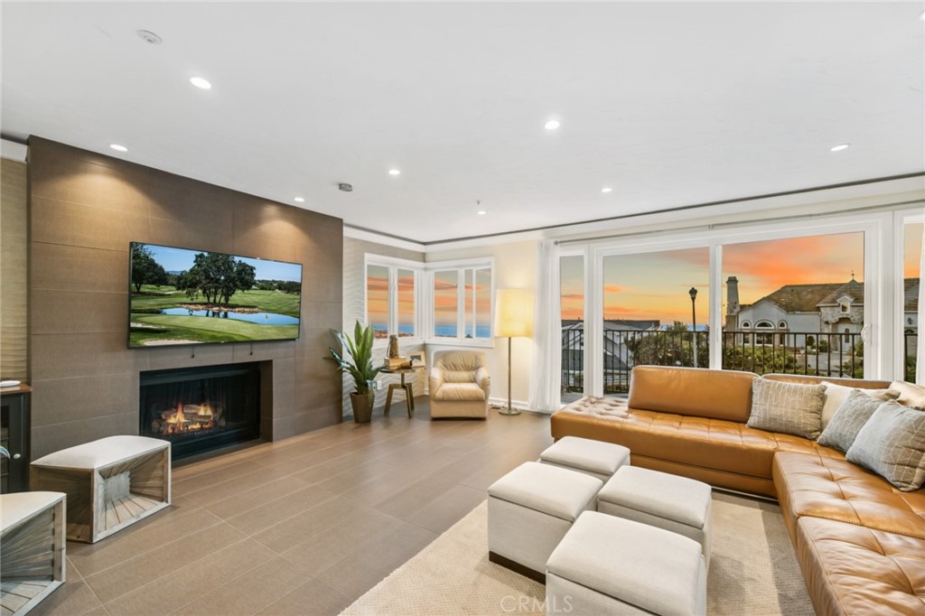 81 Marbella San Clemente, CA 92673 - Photo 1 of 65 a living room with furniture a fireplace and a flat screen tv