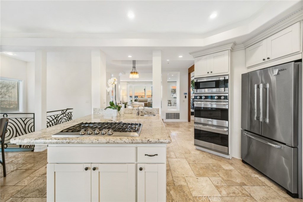 81 Marbella San Clemente, CA 92673 - Photo 22 of 65 a kitchen with stainless steel appliances granite countertop a sink stove and refrigerator