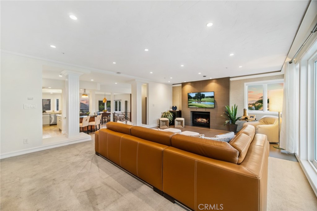 81 Marbella San Clemente, CA 92673 - Photo 34 of 65 a living room with furniture and a fireplace