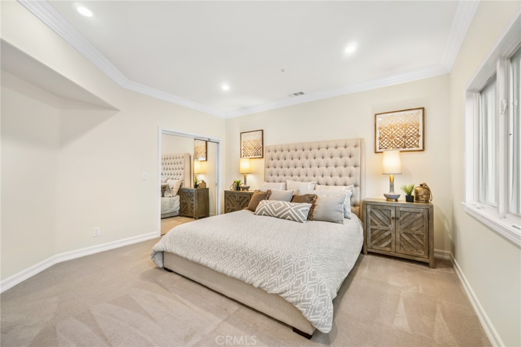 81 Marbella San Clemente, CA 92673 - Photo 43 of 65 a bedroom with a bed and a table