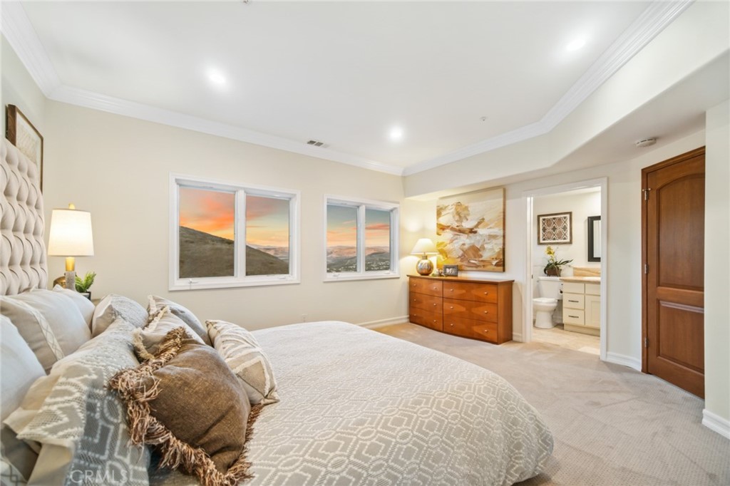 81 Marbella San Clemente, CA 92673 - Photo 46 of 65 a bedroom with a large bed and a window