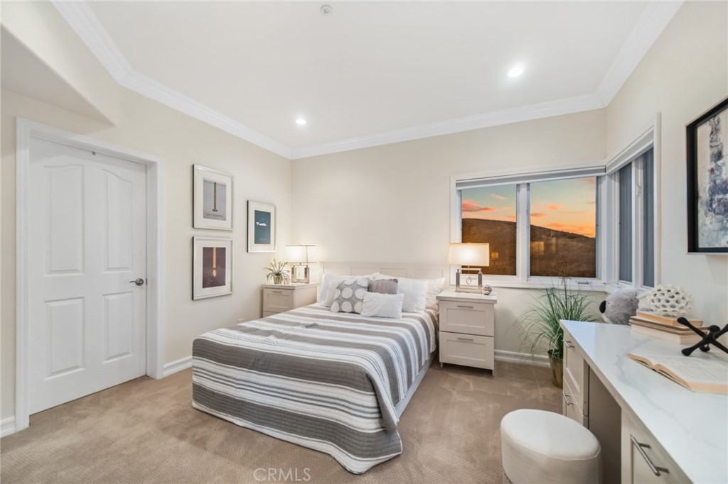81 Marbella San Clemente, CA 92673 - Photo 50 of 65 a bedroom with a bed and a large window