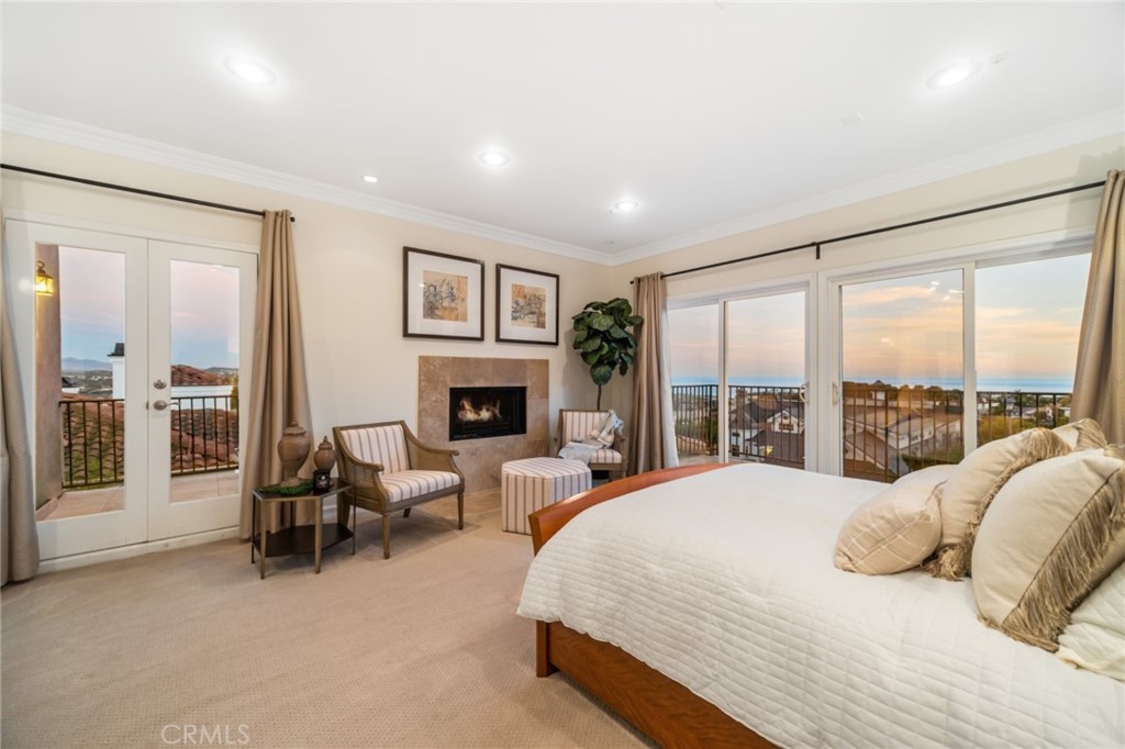 81 Marbella San Clemente, CA 92673 - Photo 51 of 65 a spacious bedroom with a large bed and a large window
