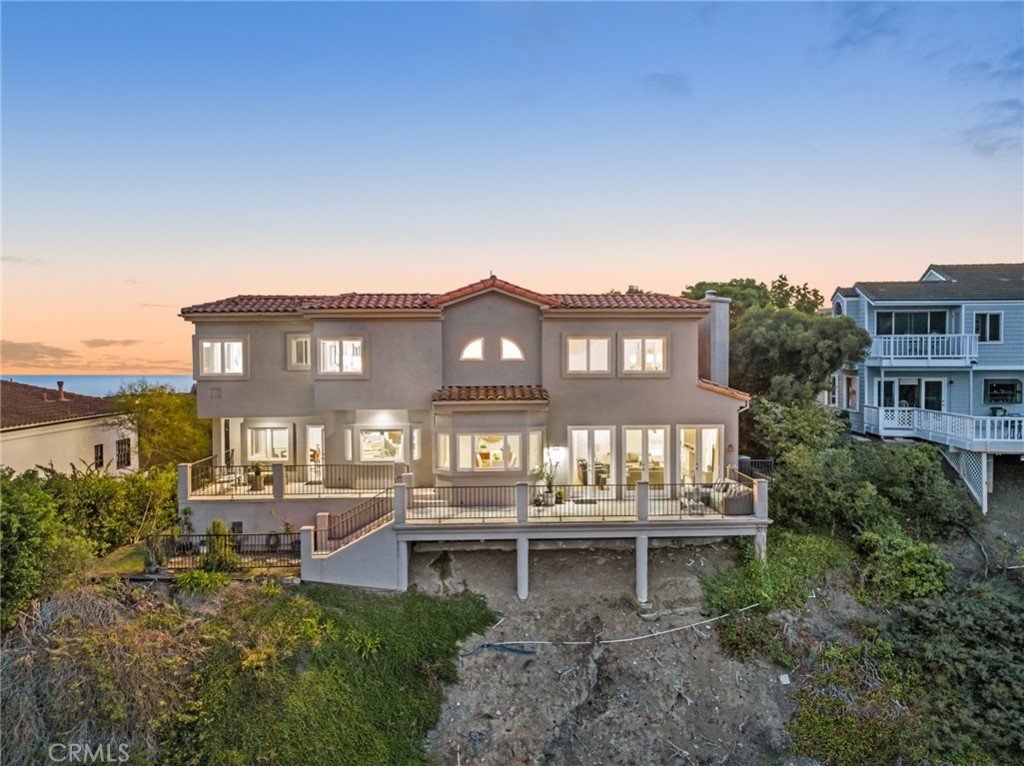 81 Marbella San Clemente, CA 92673 - Photo 57 of 65 a view of a chairs and table in a backyard